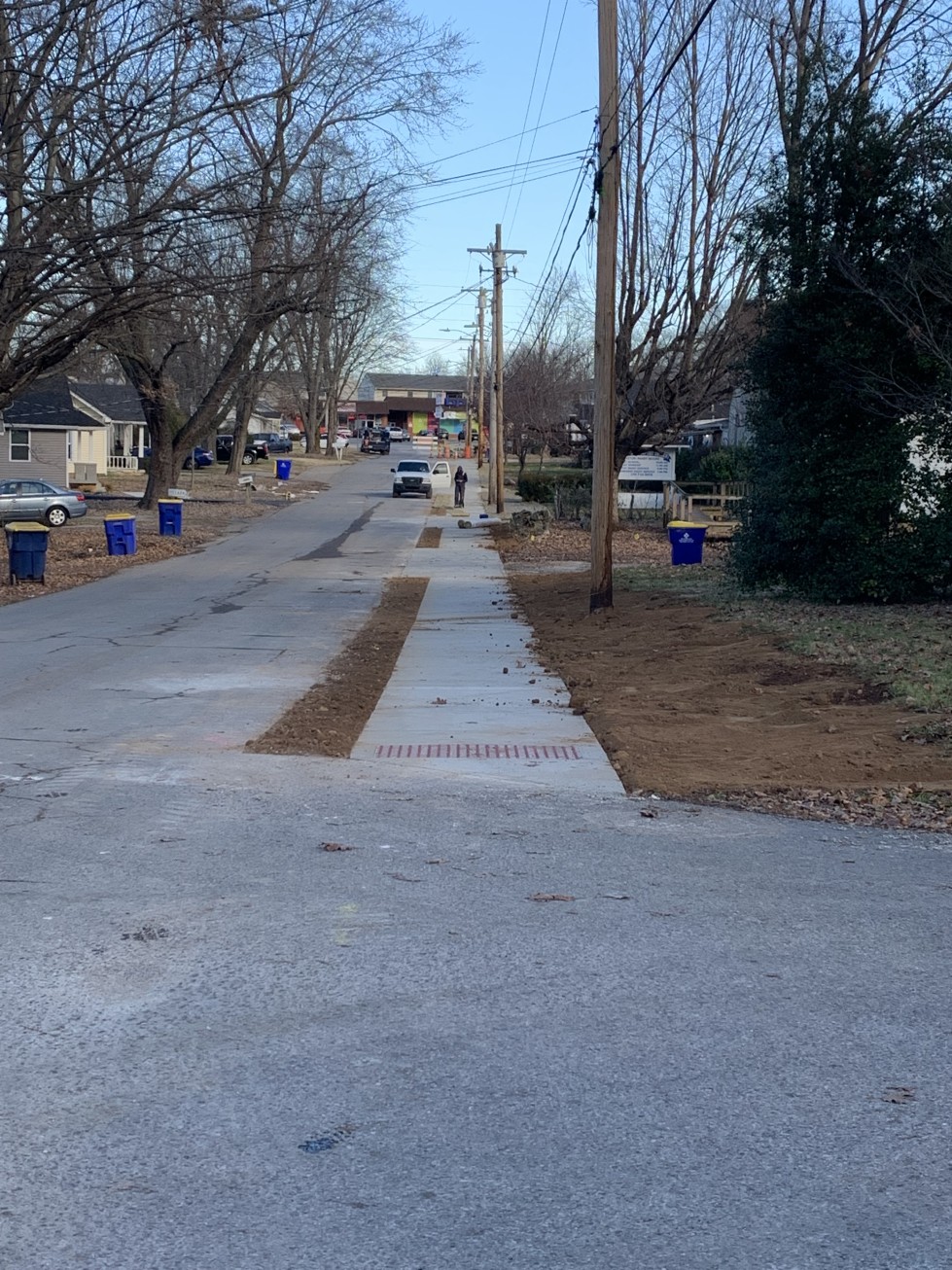 Sidewalk construction continues on west side of town