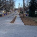 Sidewalk construction continues on west side of town
