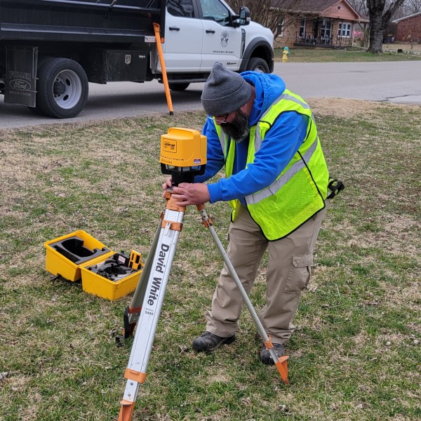 OMT III Wes Jackson prepares a laser level on Shannon Way