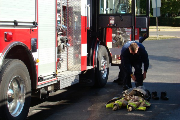 Fireman putting on gear - Bowling Green Fire Department