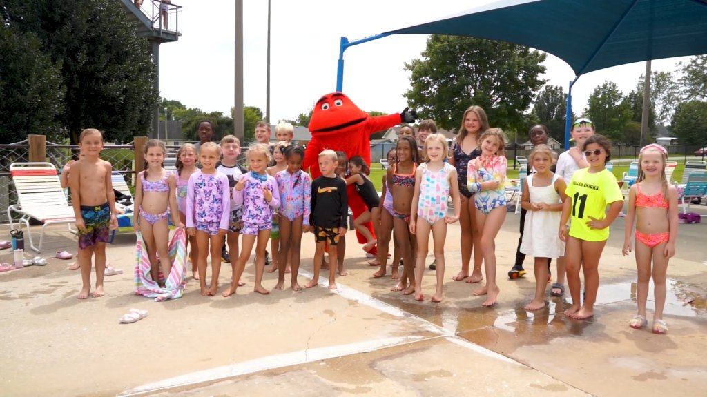 Big Red Visits Russell Sims Aquatic Center