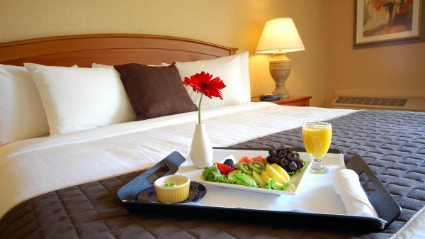 Breakast on a hotel bed